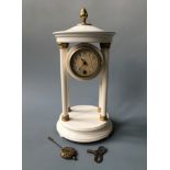 An Edwardian German pendulum pillar clock. Height 33cm.