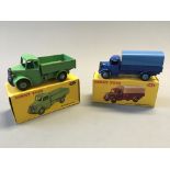 A Dinky 413 Austin covered wagon and 411 Bedford truck, in boxes. (NO CONDITION REPORT, VIEWING OF