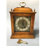 A Astral of Coventry mantel clock with brass detail to face. Height 27.5cm.