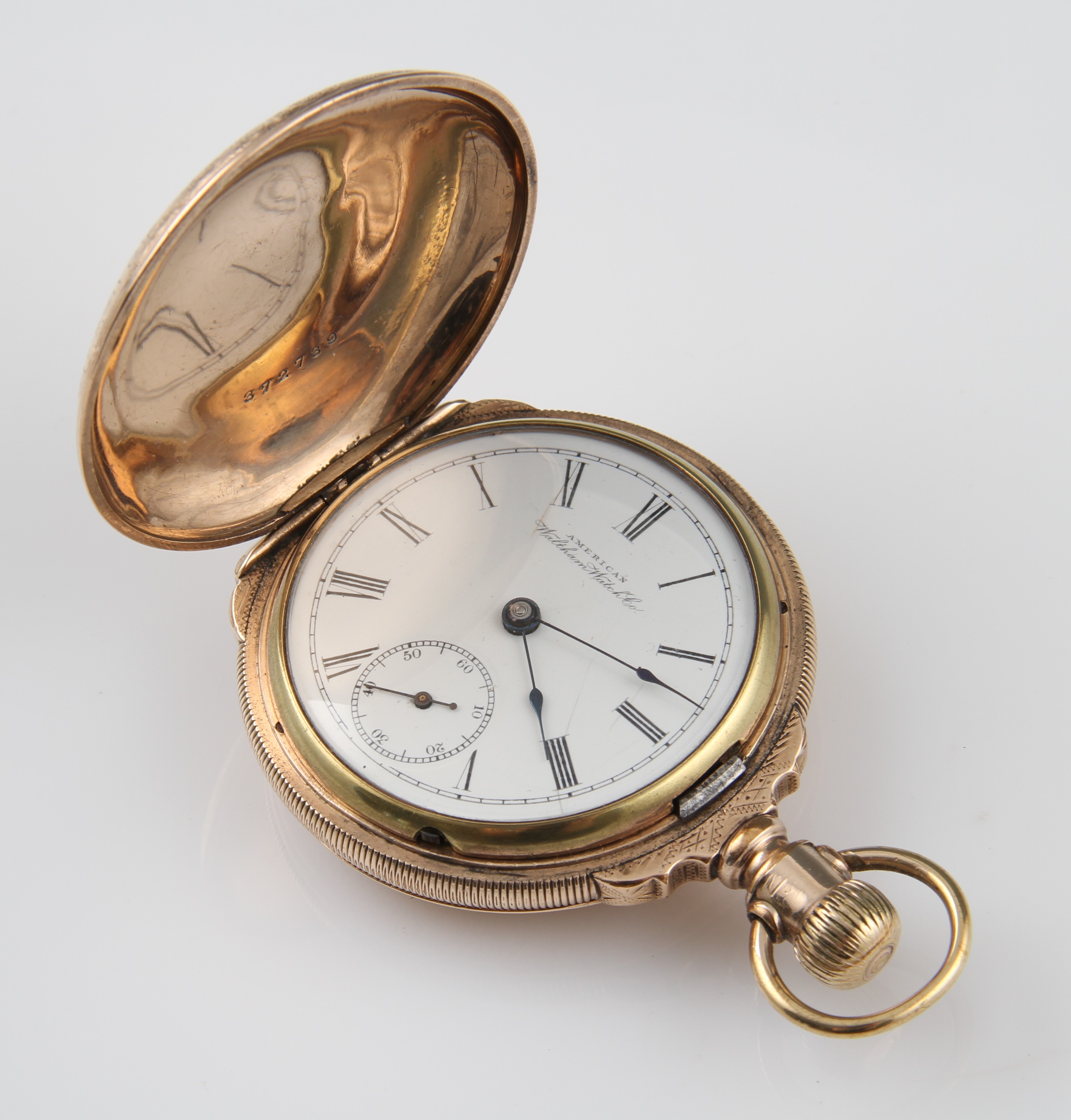 A plated P. S. Bartlett Waltham Watch Co. full hunter crown wind pocket watch, the white enamel dial