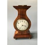 A lyre style cased French mantel clock. Height 24.5cm.
