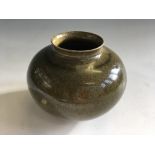 An Alan Spencer Green studio pottery green glazed vase. Signed to base. Height 11cm.