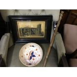 An orange and blue painted fruit bowl, framed plaque depicting Westminster Abbey and wood carved
