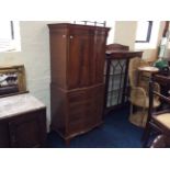 A mahogany reproduction cocktail cupboard.