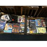 Two crates of video games including sims 2, sing star, PS4 and x box games.