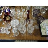 A collection of crystal cut drinking glasses, biscuit barrel, vases, coloured glassware etc.