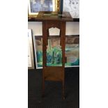 An oak arts and craft style plant stand with green tile top, serial number 430 to base.