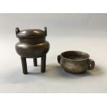 Two bronze oriental censers, one on three legged support.