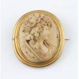 A large lava cameo brooch, the oval cameo depicting ladies portrait in profile with grape vine in