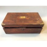 A rosewood writing desk with leather insert and plaque inscribed HH.