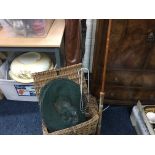 Fishing rods in leather case, various fishing items and wicker basket.