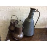 Three copper handbeaten jugs.