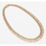 A three colour 9ct gold fringe necklet, hallmarked Birmingham 1973, length approx. 45cm.