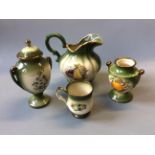 A selection of green Staffordshire pottery including five jugs, vases, mugs, etc.