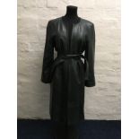 A Jean Muir dark green leather coat with belt, size 10.