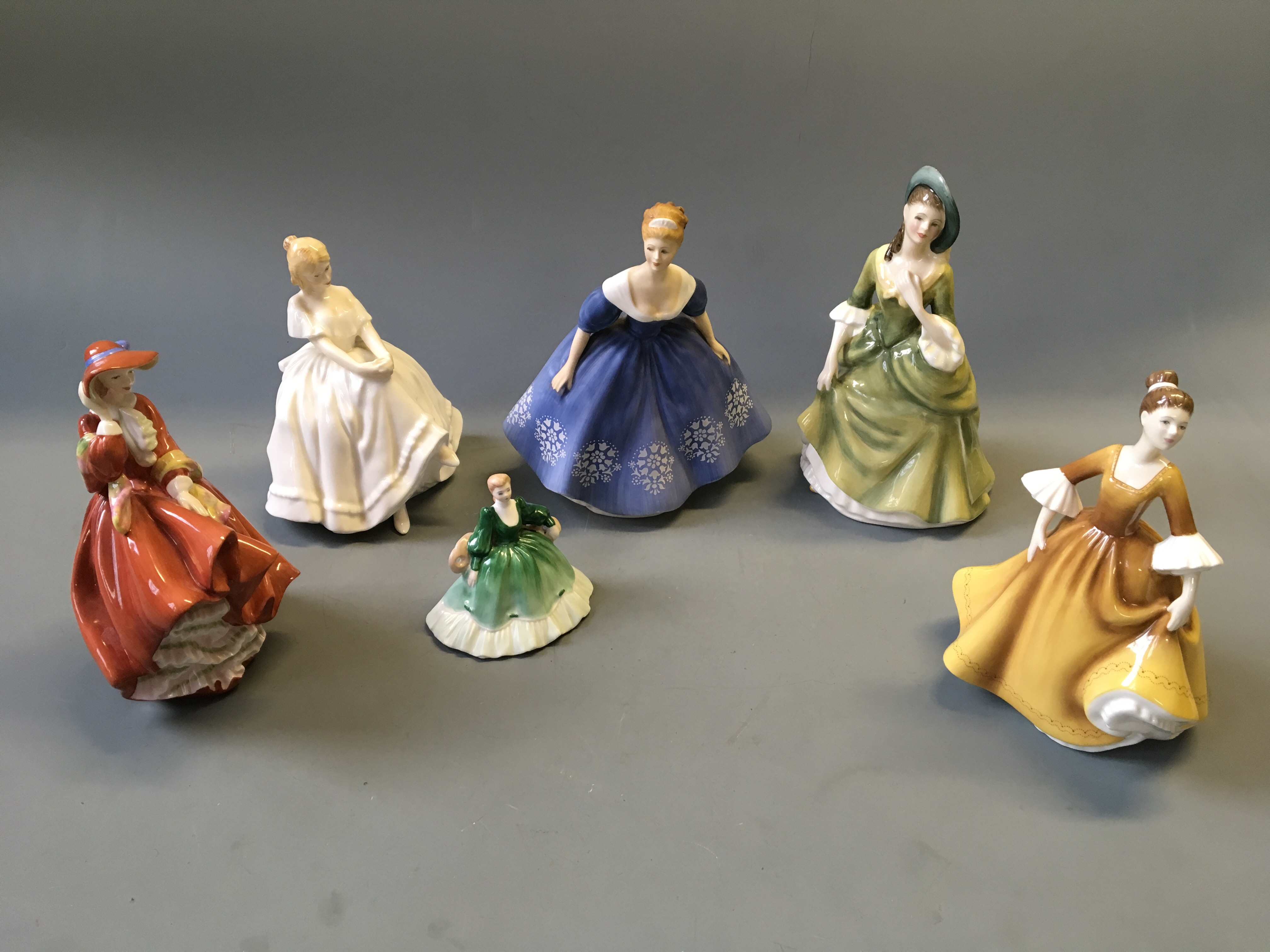 Five Royal Doulton figurines, Sandra, Stephanie, Heather, Nina and Top o' the Hill, together with