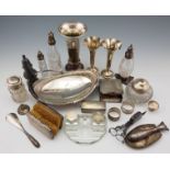 A collection of hallmarked silverware to include, vases, a cigarette box, napkin rings, a glass