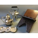 A wooden carved design Quran stand marked 1916. F Down, with two silver plated teapots and tray.