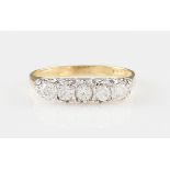 *An 18ct yellow gold diamond five stone ring, set with five graduated round brilliant cut