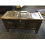 An oak blanket box.