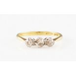 A three stone diamond ring, set with three graduated old cut diamonds, stamped 18ct PLAT, ring