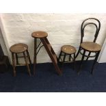 Two wooden stools, a hoop backed chair and a ladder stool.