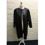 A Jean Muir black leather coat with buttons and pockets.