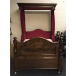A mahogany Victorian half tester 4 foot 6 inches bed with red curtain sides and mattress.