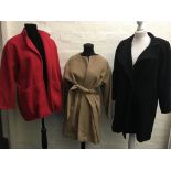 Three fur coats, one camelhair with belt, size 8, one red and one black.