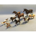 Nine various horse figurines, some Beswick, with three Beswick hunting dogs.