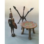 An African stool with bead design, wooden warrior figurine and wooden stand.