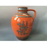 A West German pottery vase, orange with blue detail marked 6010-45 to base. Height 44.5cm.