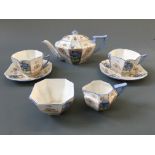 A Shelley tea set in blue pansy design including two cups and saucers, tea pot, milk jug and sugar