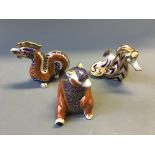 Three Royal Crown Derby figurines, dragon, bear and seahorse.