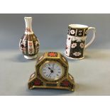 A Royal Crown Derby Old Imari mantel clock and orchid vase, with a Traditional Imari tankard.