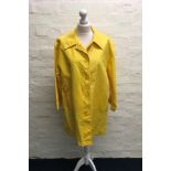 A Nina Ricci yellow buttoned coat, size 38.