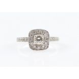 A diamond ring, set with a central round brilliant cut diamond, measuring approx. 0.40ct, surrounded