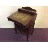 An Edwardian mahogany Davenport with three drawers to side and fitted interior.