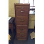 A Thos. Smith & Son four drawer filing cabinet.