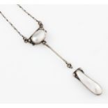 A mother of pearl necklet, set in white metal, (A/F dropper is detached).