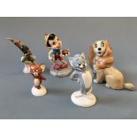 Five figurines including Royal Doulton Disney Pinocchio, Wade whimsie Disney Lady and Peter Pan