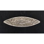 A late 18th Century silver filigree shuttle each side in quill work within rope border, slight