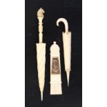 Three ivory needlecases comprising a quiver form example, one side inset with a verre eglomise