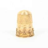 A hallmarked gold thimble, the plain frieze with a wirework and ball border over a plain rim, 1892