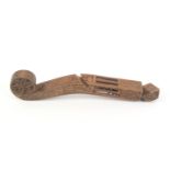 A good early 19th Century wooden English knitting stick, the violin scroll terminal with star carved