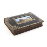 An unusual papier mache book form sewing box commemorating The Great Exhibition, 1851, titled tooled