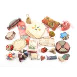 A collection of pincushions including home made examples, an embroidered silk ïSouvenirÍ envelope, a