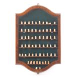 A mahogany and boxwood strung thimble display cabinet of Silvester type, glazed crossbanded door,