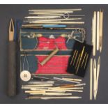 A collection of crochet hooks and related items comprising a French gilt tooled leather case with
