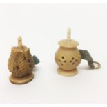 Two vegetable ivory tape measures with pierced and carved decoration, both with complete tapes,